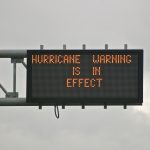 highway sign warns of impending hurricane