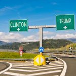 illustration of diverging roads, each with a sign, one saying "Clinton" and the other "Trump"